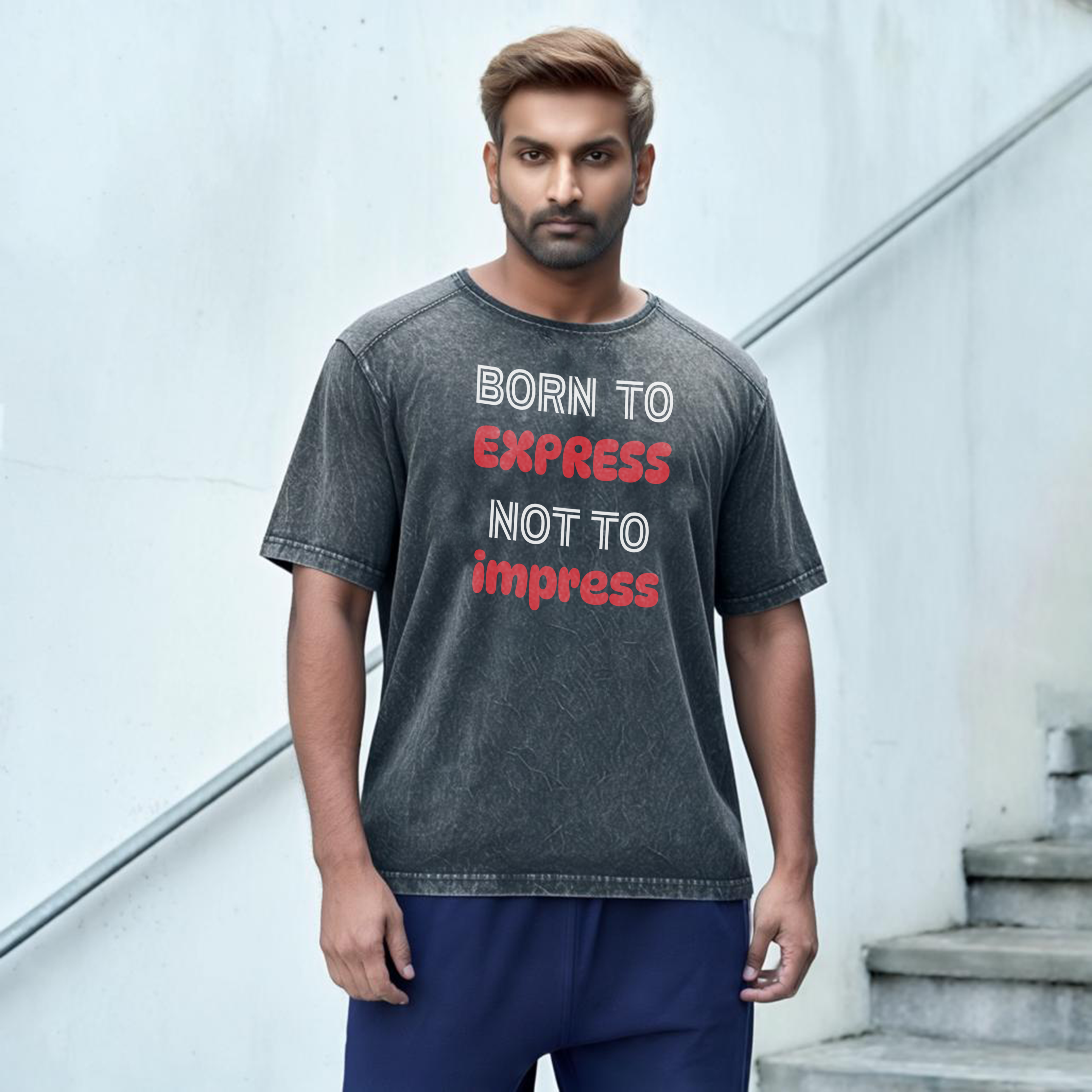 Oversized gray t-shirt with the text 'BORN TO EXPRESS NOT TO IMPRESS' printed in red on the front.
