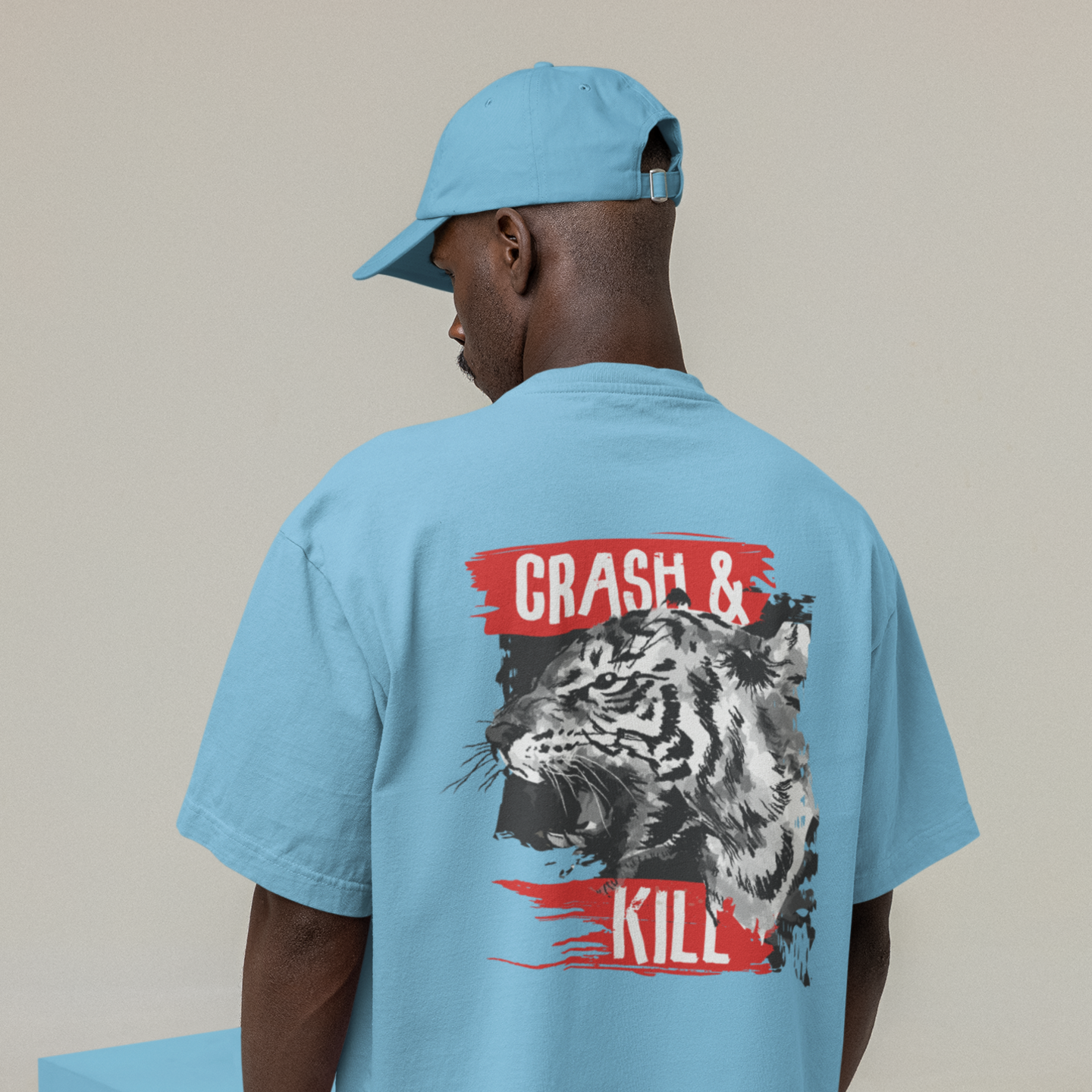 oversized white T-shirt with a graphic print on the back showing a tiger and the text 'CRASH & KILL'.