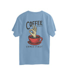oversized T-shirt with a graphic print on the back showing a coffee cup and the text 'Coffee always comes first'.