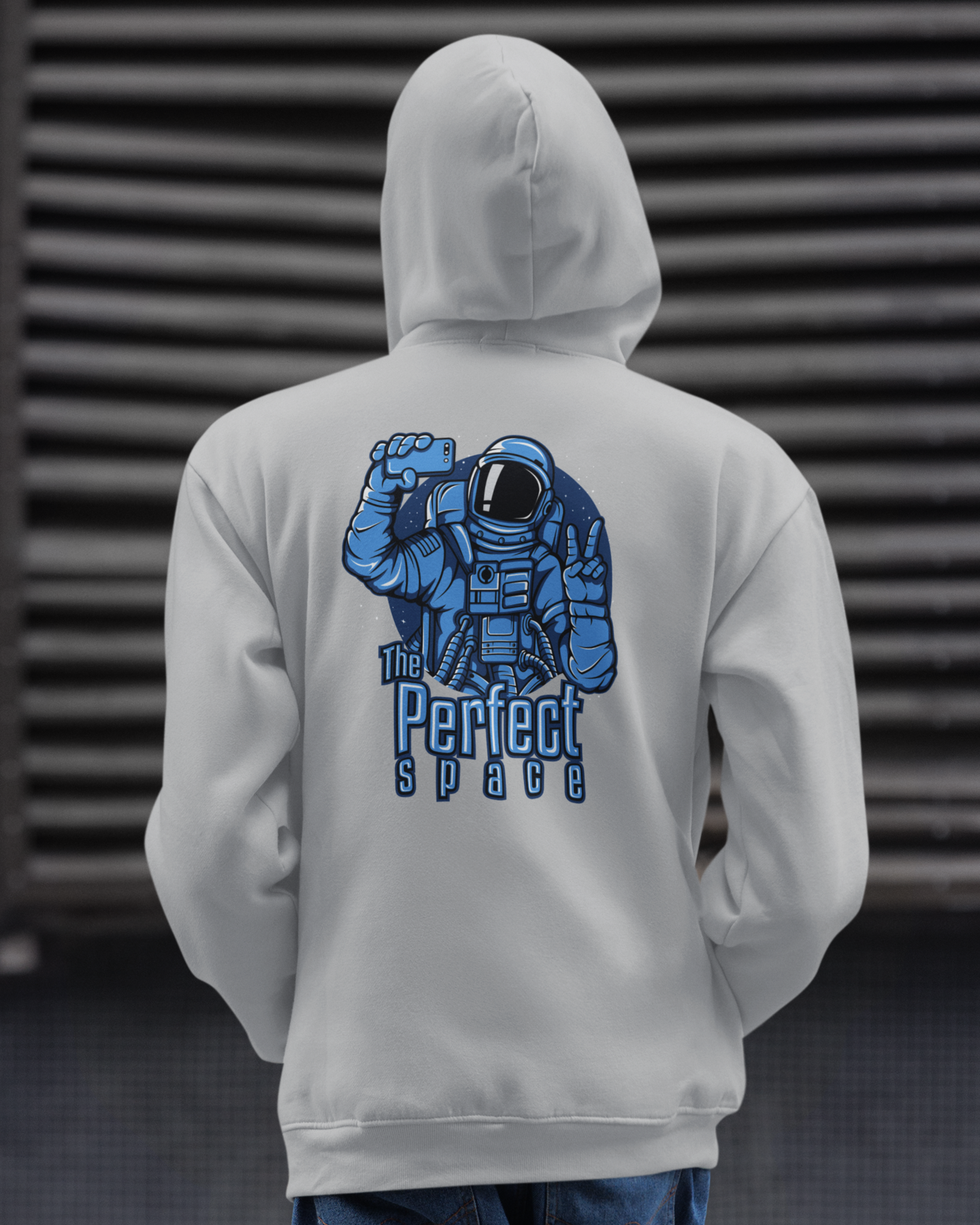 grey hoodie with an astronaut graphic and text on the back
