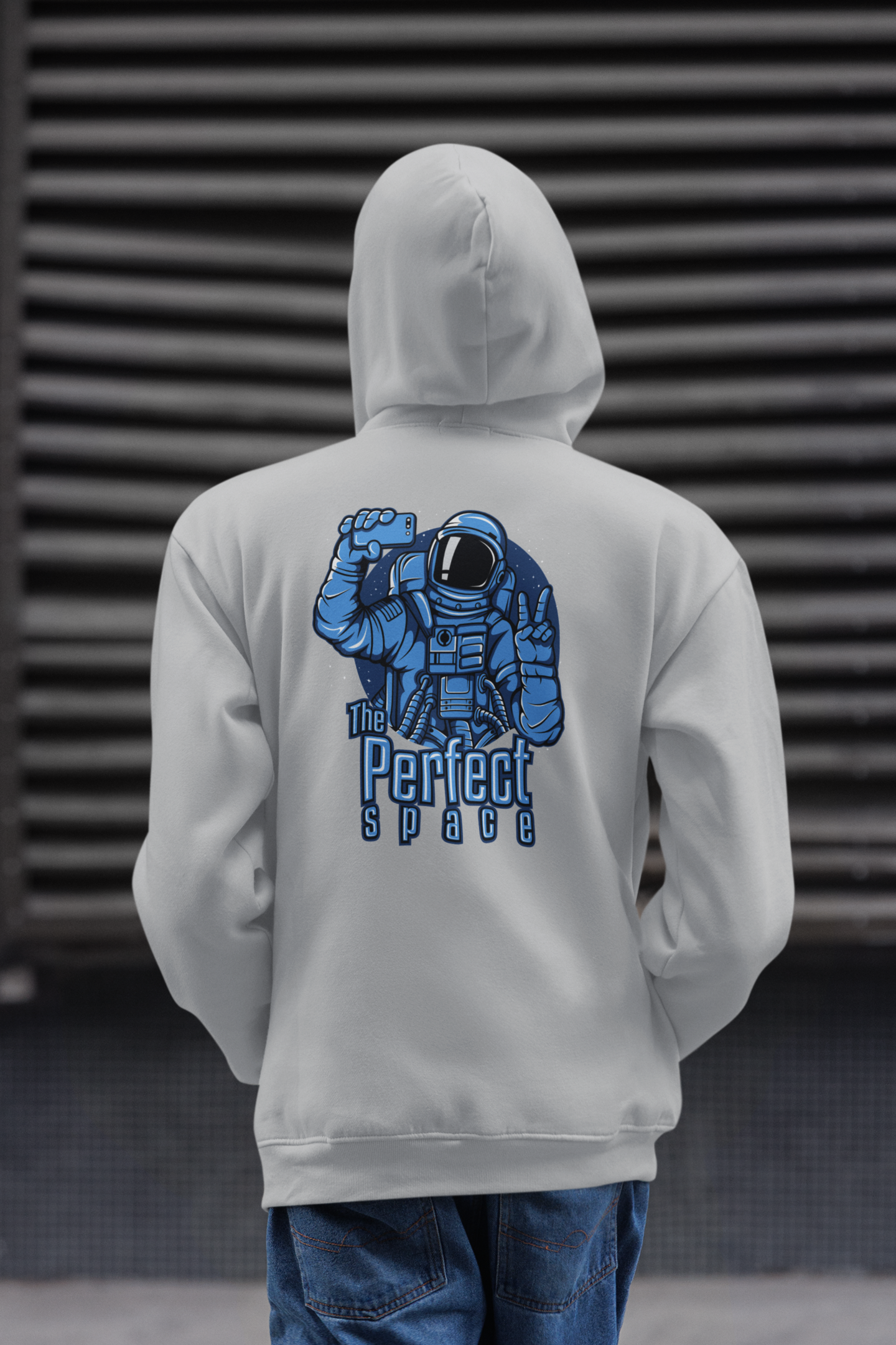 grey hoodie with an astronaut graphic and text on the back