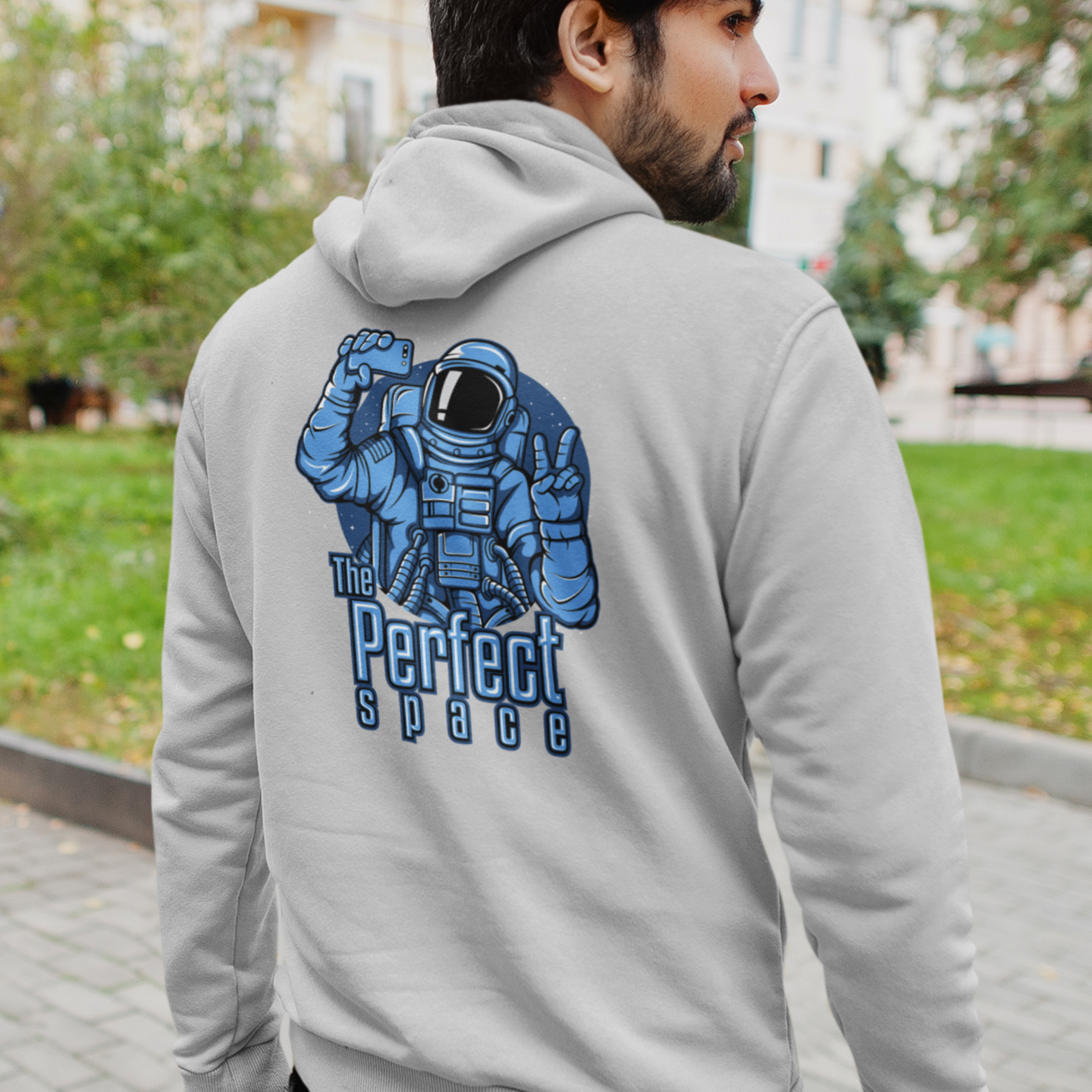 gray hoodie with an astronaut graphic on the back