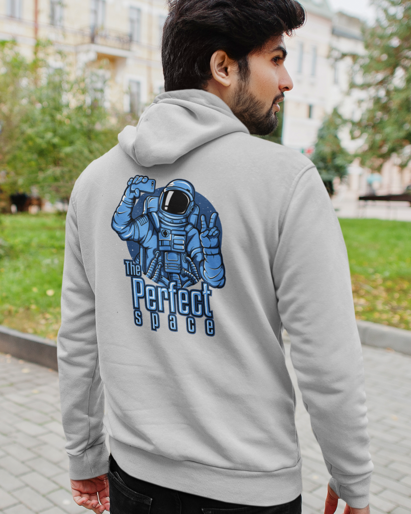 gray hoodie with an astronaut graphic on the back