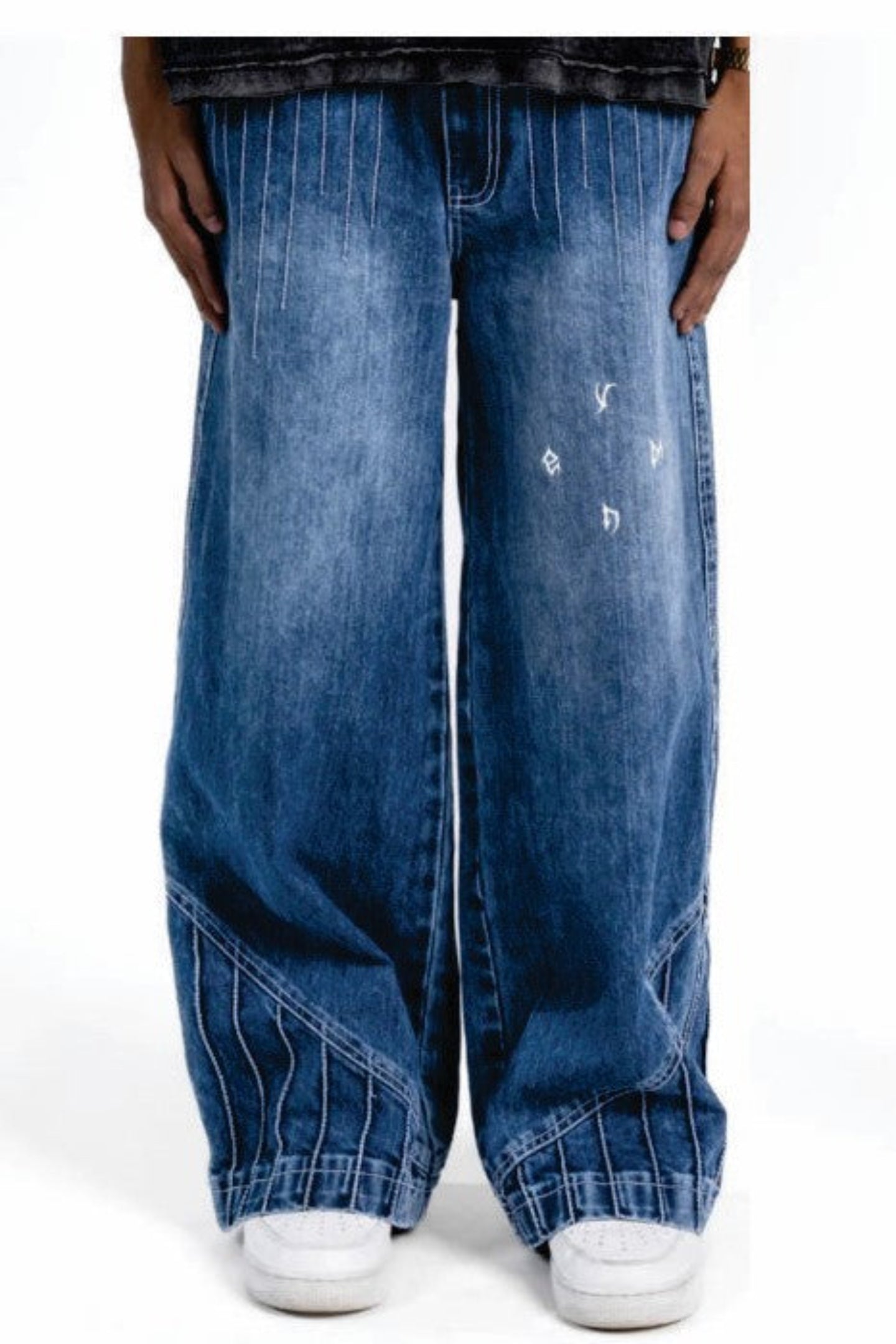 Blue jeans worn by a person on a white background